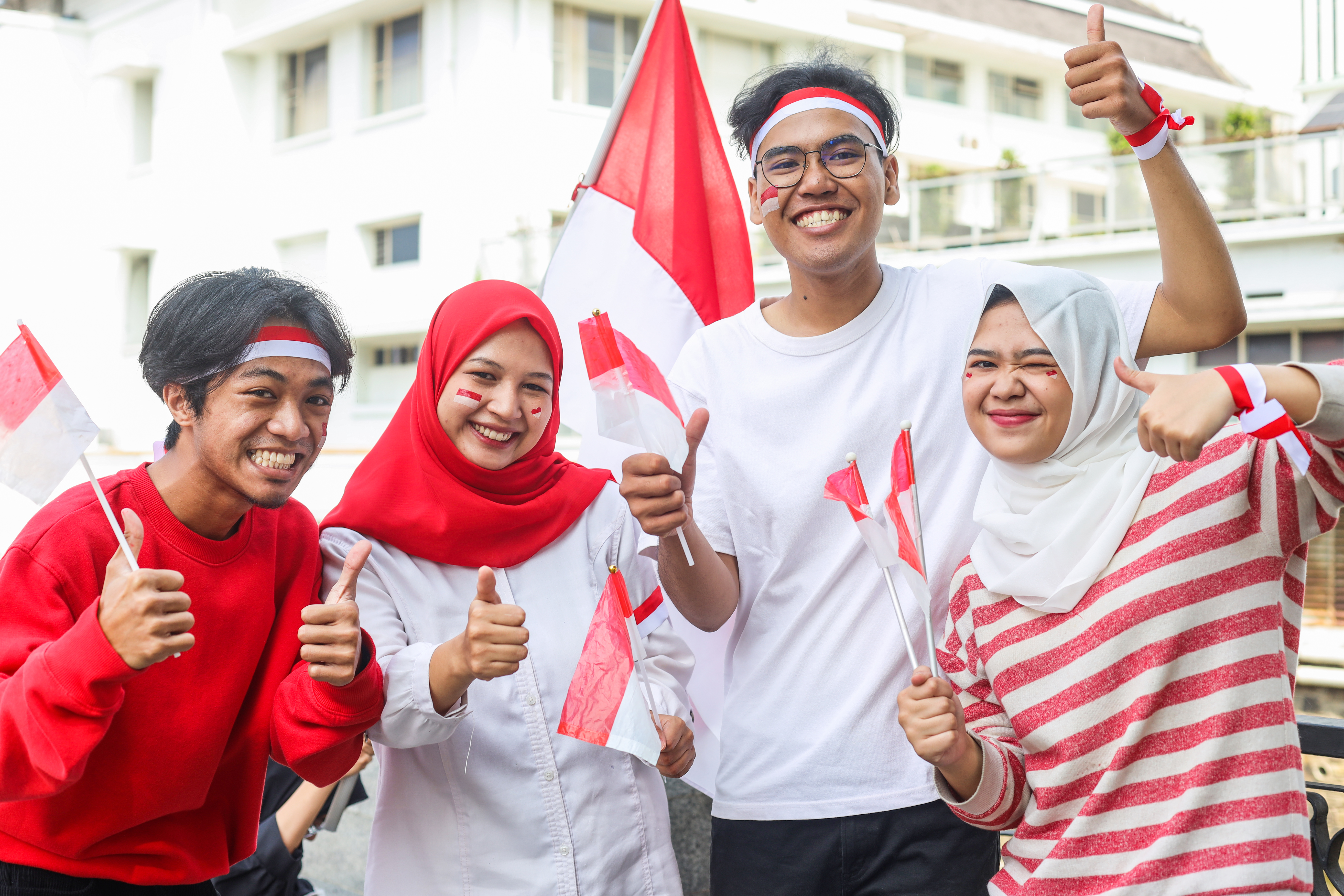 Excited young people raised arm on Indonesian independence day celebration